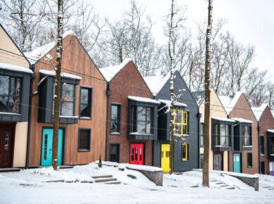 fancy modern buildings in cold winter with snow on roofs