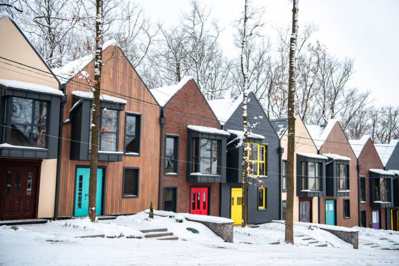 fancy modern buildings in cold winter with snow on roofs