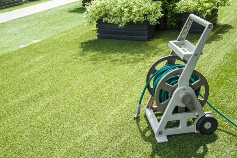 garden watering irrigation hose on the lawn